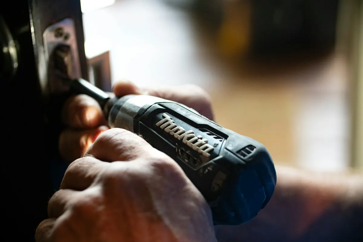 Close view of a person using a cordless drill